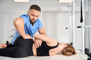 chiropractor working with its patient