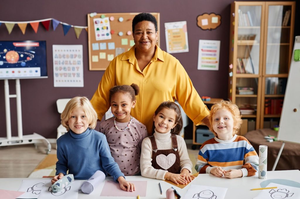 a woman and children posing for a picture