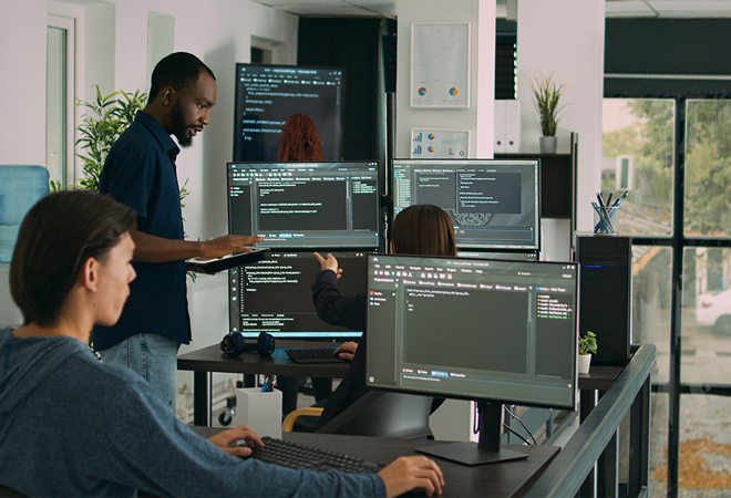 a group of people working on computers