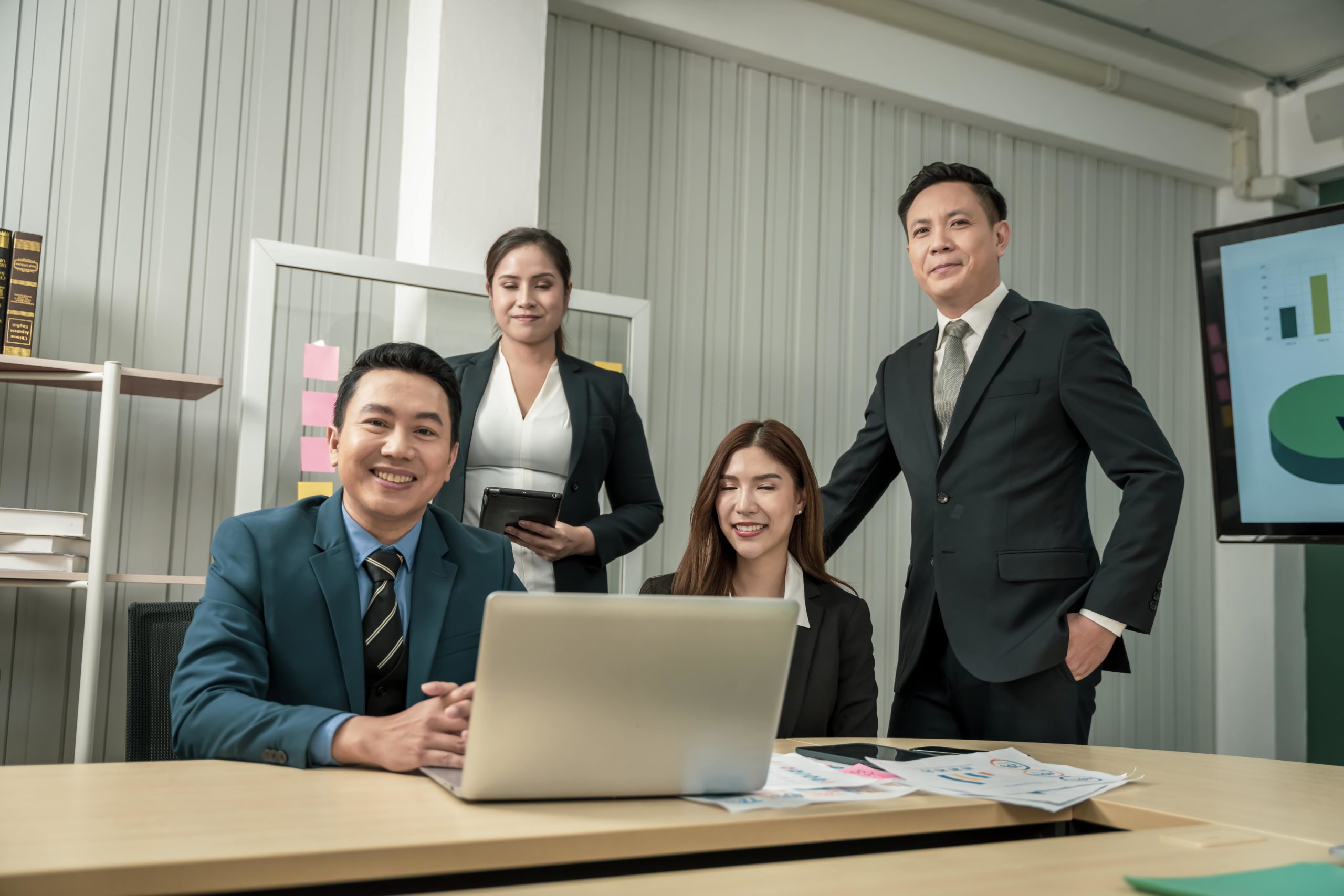 a group of people in suits