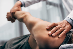 Chiropractor stretching hand