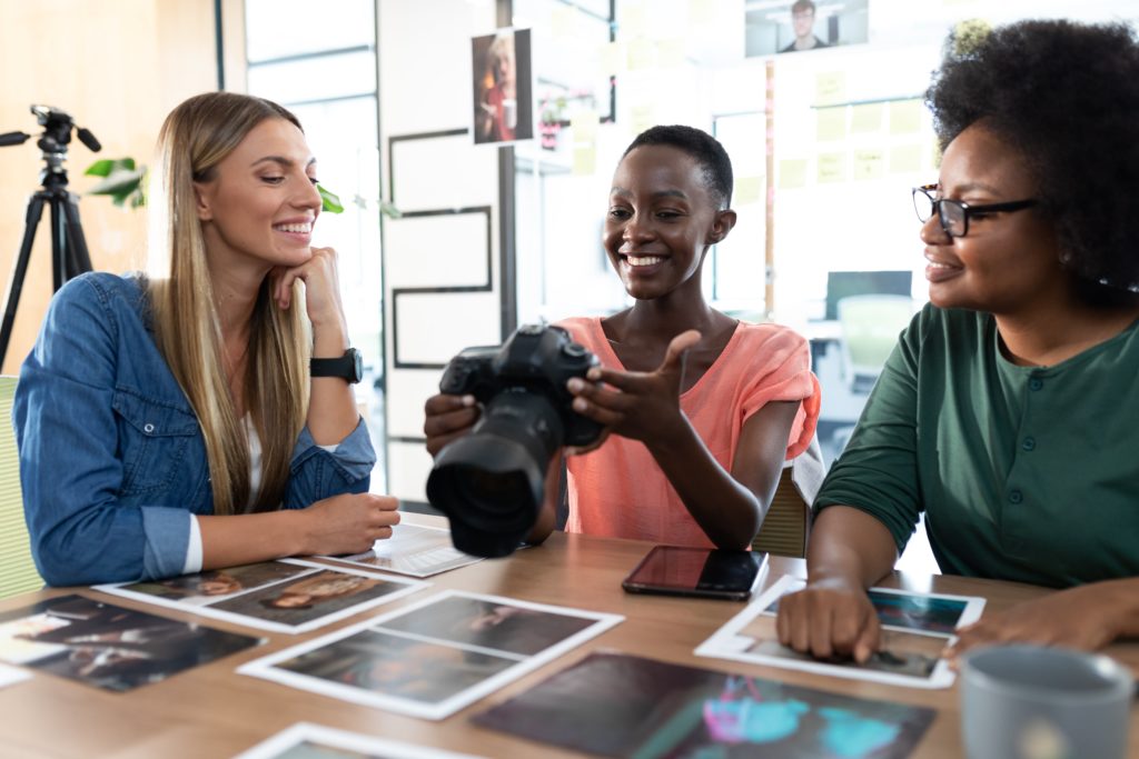 a group of women looking at a camera