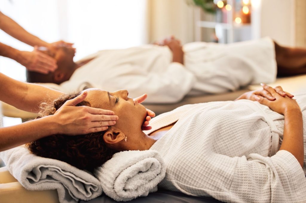 a woman receiving a face massage