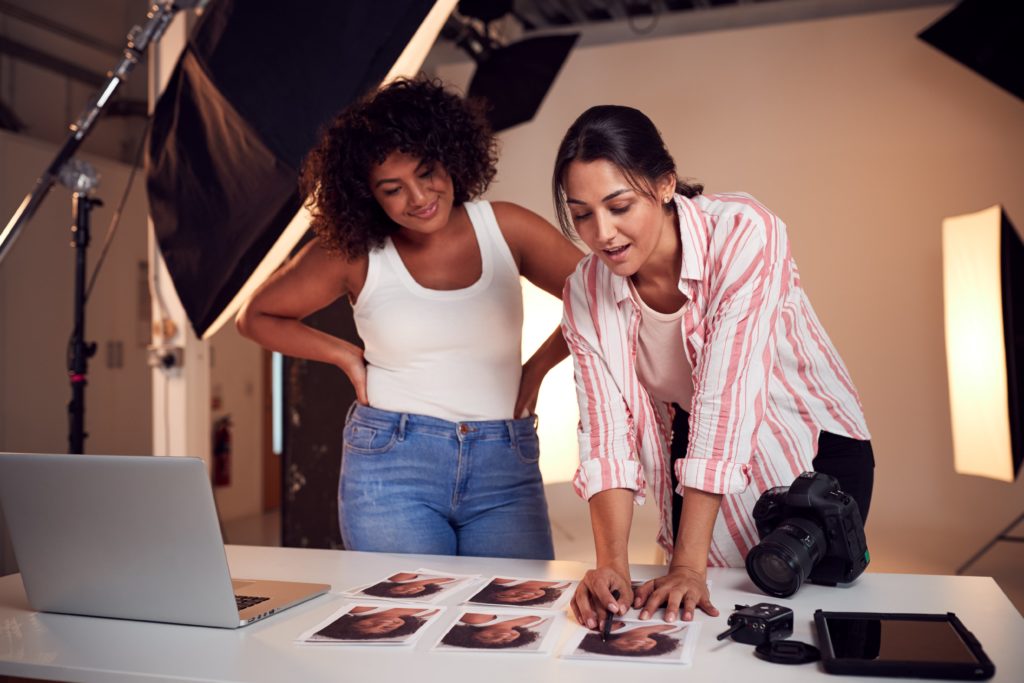 a woman looking at a photo of another woman