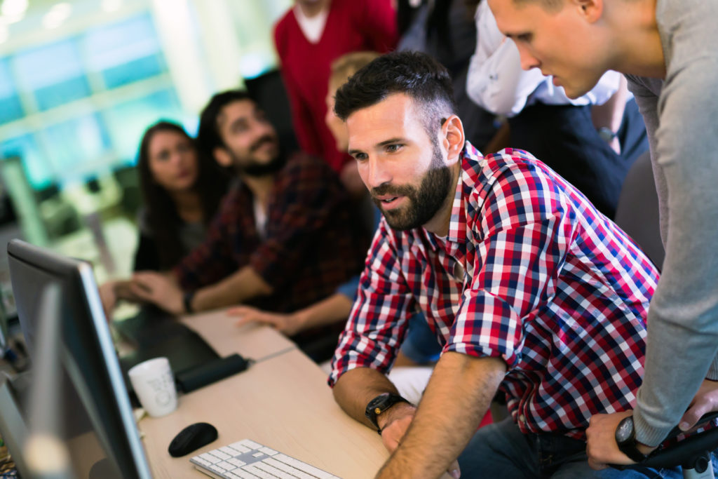 Programmer working in a software developing company office